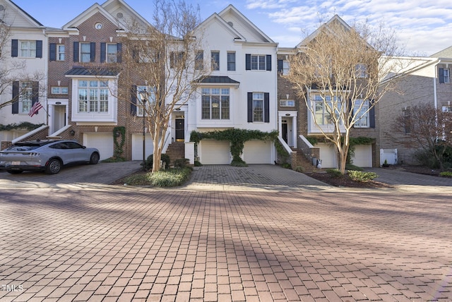 townhome / multi-family property featuring a garage