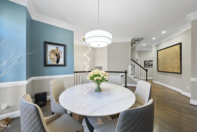 dining area with dark hardwood / wood-style flooring and ornamental molding