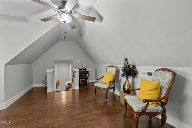 sitting room featuring vaulted ceiling, ceiling fan, and dark wood-type flooring