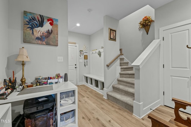 foyer entrance with light wood-type flooring