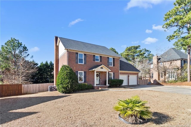 colonial home with a garage