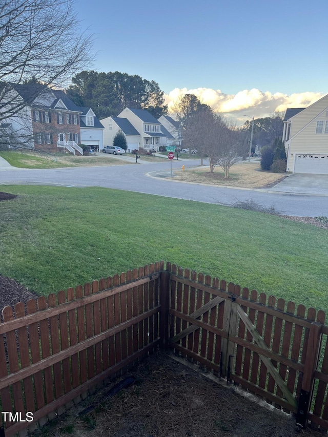 view of yard at dusk