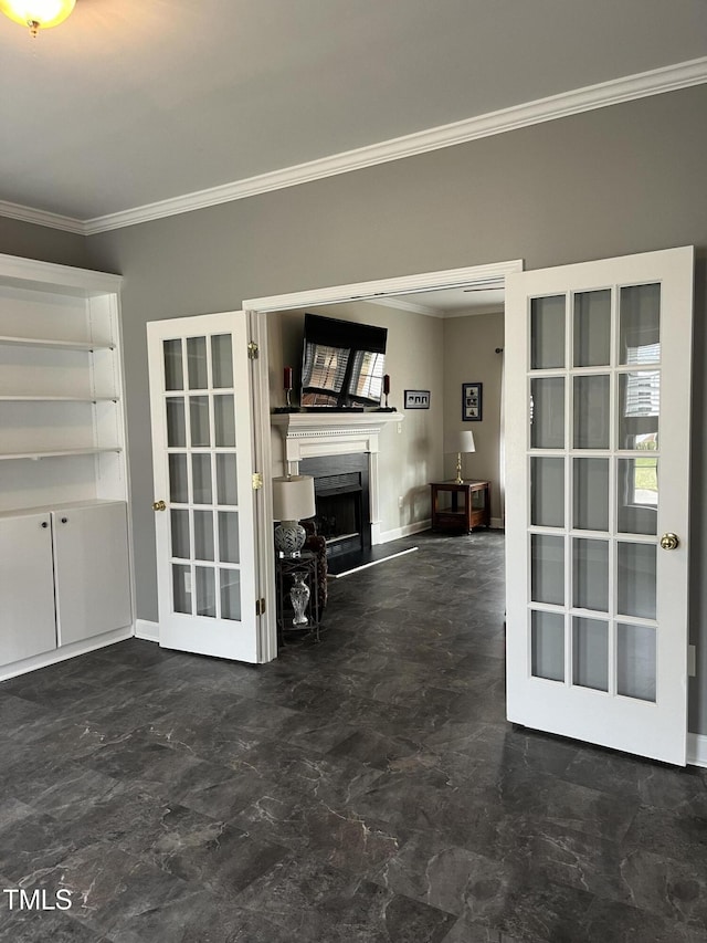 unfurnished living room featuring french doors and crown molding