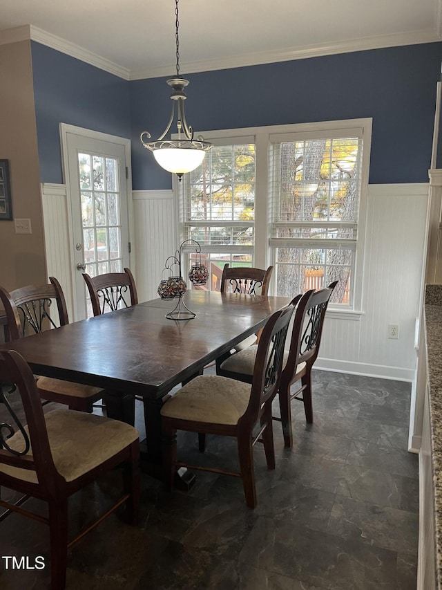 dining area featuring crown molding