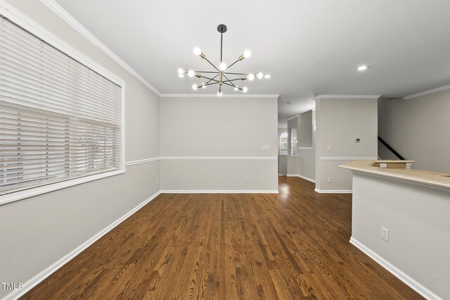 7340 Doverton Ct, Raleigh, NC 27615 - spare room featuring a chandelier, wood finished floors, baseboards, crown molding, and recessed lighting