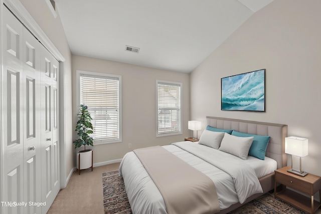 7340 Doverton Ct, Raleigh, NC 27615 - bedroom with baseboards, light colored carpet, lofted ceiling, and a closet