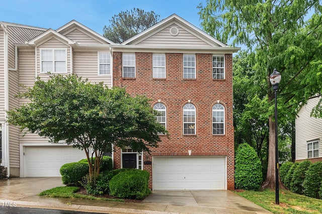 7340 Doverton Ct, Raleigh, NC 27615 - view of front facade with concrete driveway, an attached garage, and brick siding