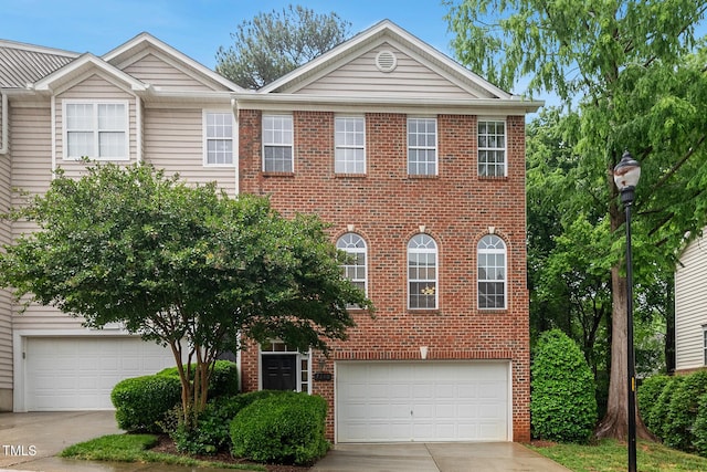 7340 Doverton Ct, Raleigh, NC 27615 - view of front of home with driveway, brick siding, and an attached garage