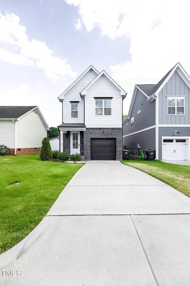 view of front of house with a garage and a front lawn