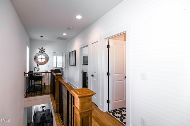 hall with light hardwood / wood-style flooring