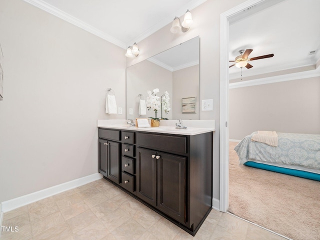 bathroom featuring ceiling fan, ornamental molding, and vanity