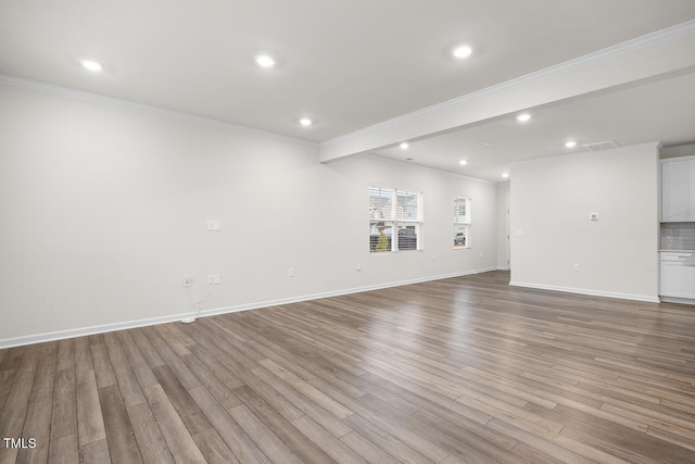 unfurnished living room with light wood-type flooring and crown molding