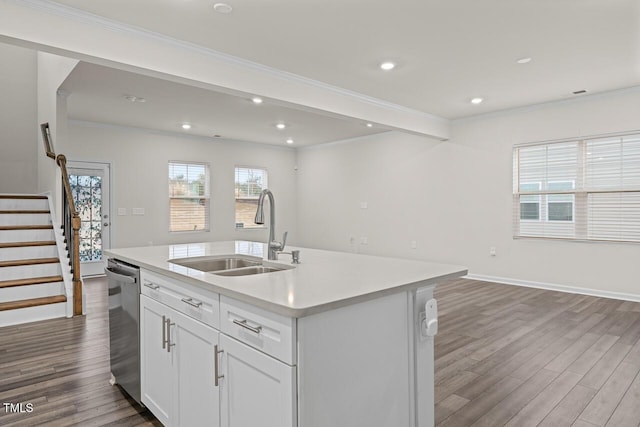 kitchen featuring dishwasher, a center island with sink, sink, white cabinetry, and wood-type flooring