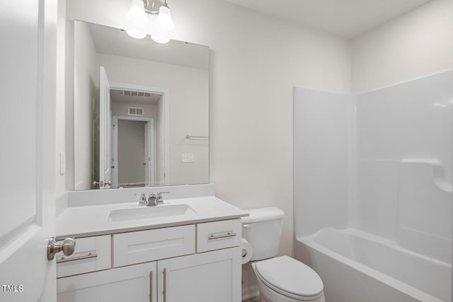 full bathroom with bathtub / shower combination, vanity, and toilet