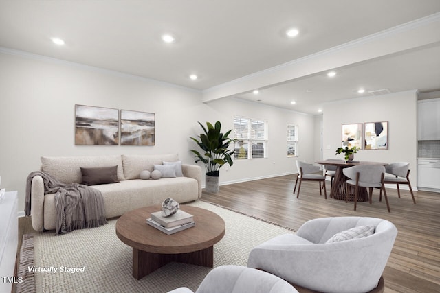 living room with wood-type flooring and crown molding