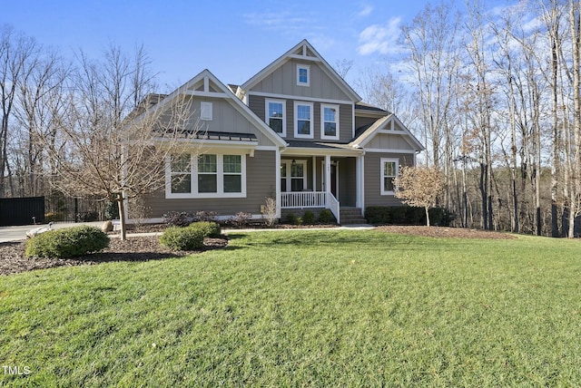 craftsman inspired home with a porch and a front lawn