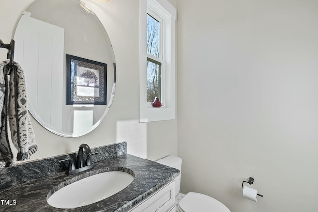 bathroom with vanity and toilet