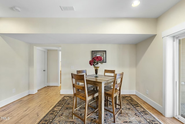 dining room featuring hardwood / wood-style flooring