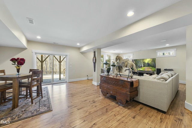 living room with light hardwood / wood-style floors