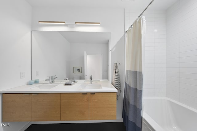 bathroom featuring vanity and shower / bath combo