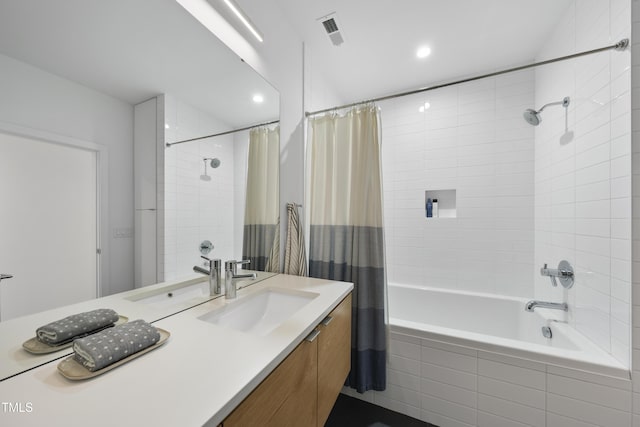 bathroom with vanity and shower / bath combo