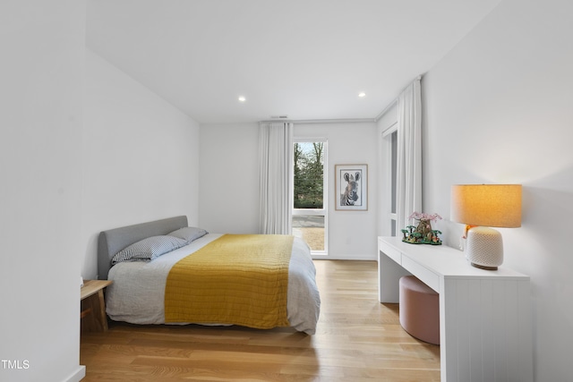 bedroom with light hardwood / wood-style flooring