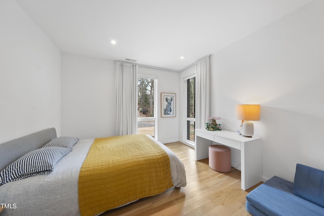 bedroom with light hardwood / wood-style floors