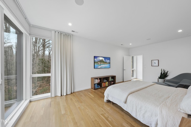 bedroom with light hardwood / wood-style floors