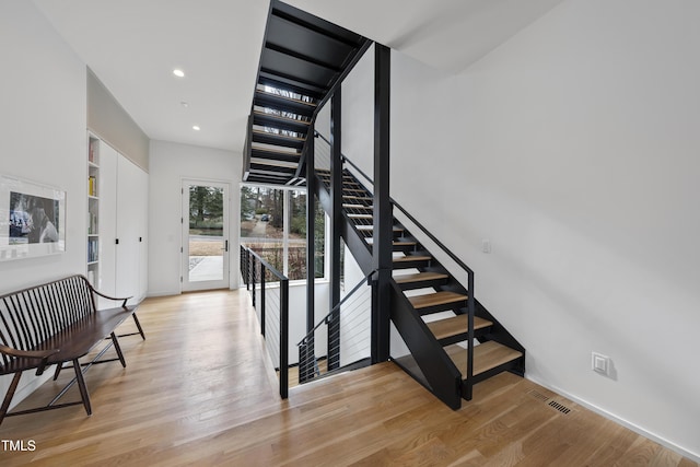 stairway featuring hardwood / wood-style floors