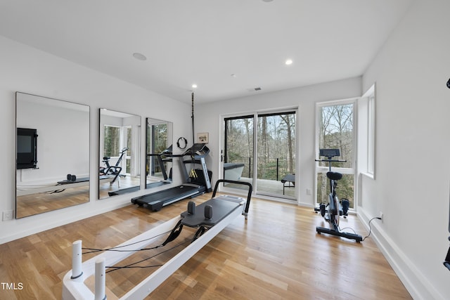 exercise area with light hardwood / wood-style floors