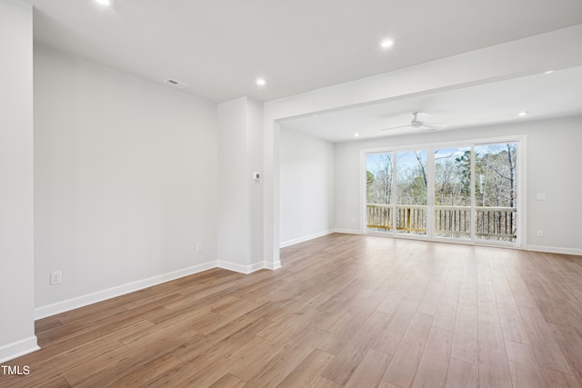 spare room with ceiling fan and light hardwood / wood-style flooring