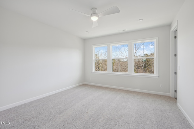 carpeted empty room with ceiling fan