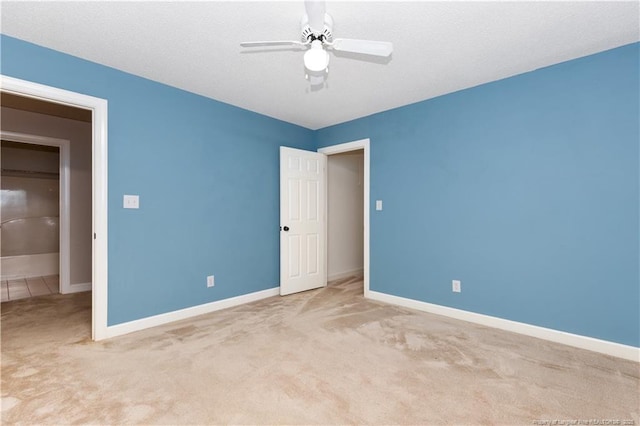 unfurnished bedroom with ceiling fan and light carpet