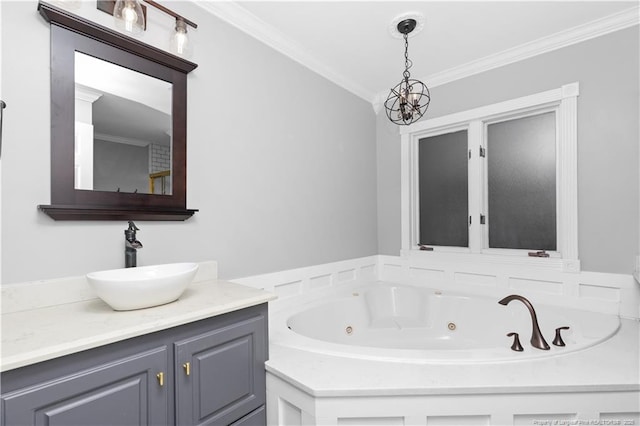 bathroom featuring a bathing tub, vanity, crown molding, and an inviting chandelier