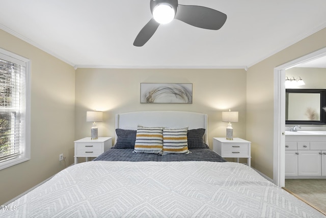 carpeted bedroom with ensuite bath, ceiling fan, sink, and ornamental molding