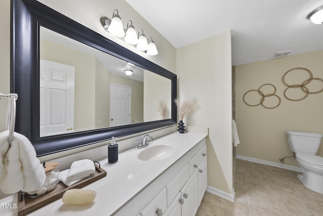 bathroom featuring vanity and toilet