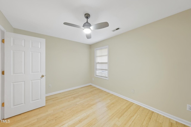 empty room with light hardwood / wood-style floors and ceiling fan