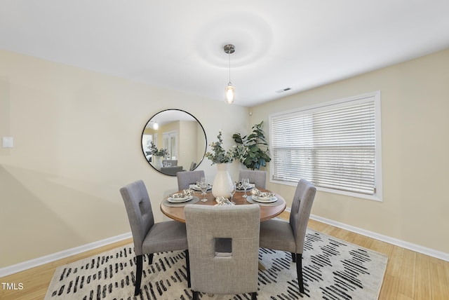 dining room with light hardwood / wood-style flooring