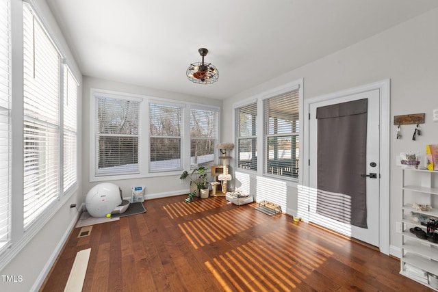 unfurnished sunroom with visible vents