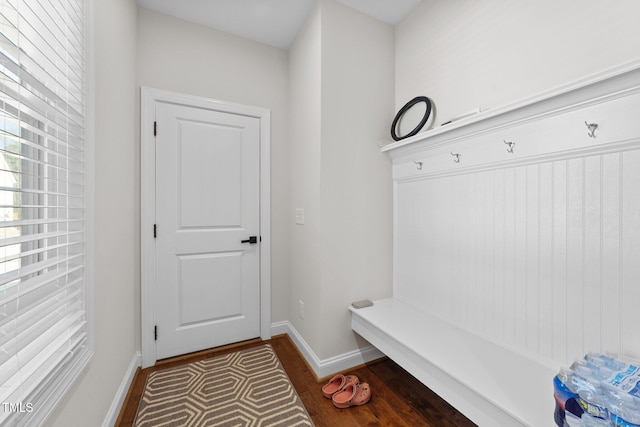 mudroom featuring baseboards and wood finished floors