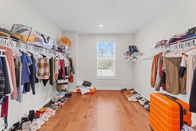 spacious closet with wood finished floors