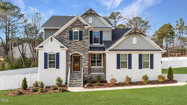 craftsman-style home with brick siding and a front yard