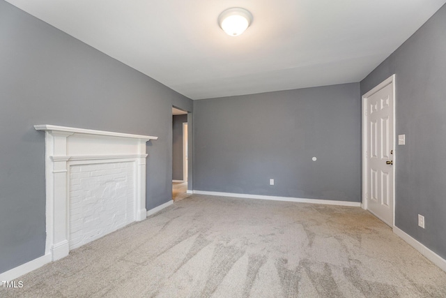 unfurnished living room with light colored carpet