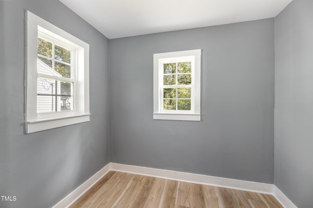 unfurnished room featuring light hardwood / wood-style floors