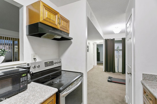 kitchen with light carpet, a textured ceiling, and stainless steel electric stove