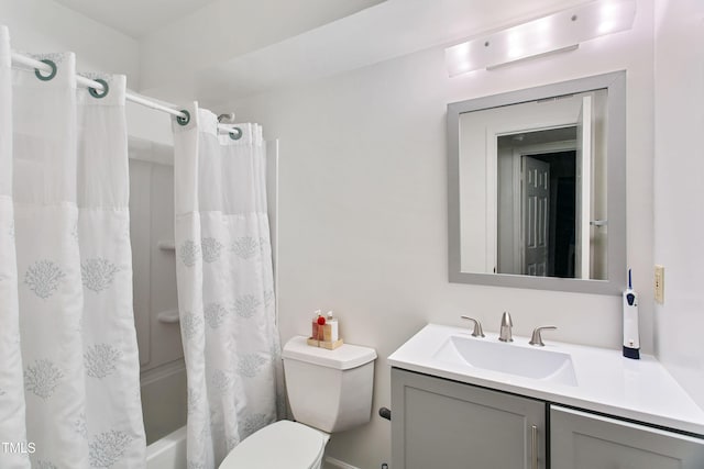 full bathroom featuring shower / tub combo, vanity, and toilet