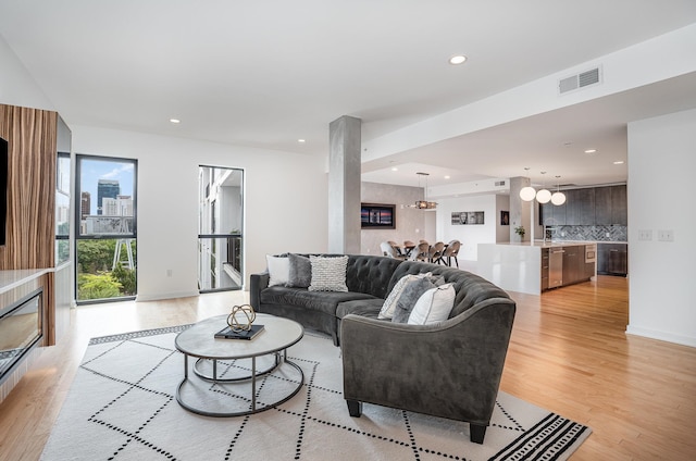 living room featuring light wood-type flooring