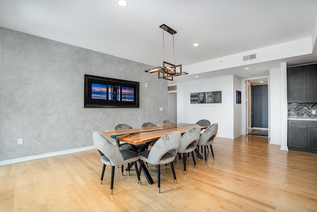 dining space with light wood-type flooring