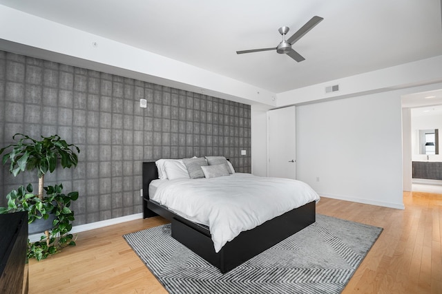 bedroom with ceiling fan and light hardwood / wood-style floors