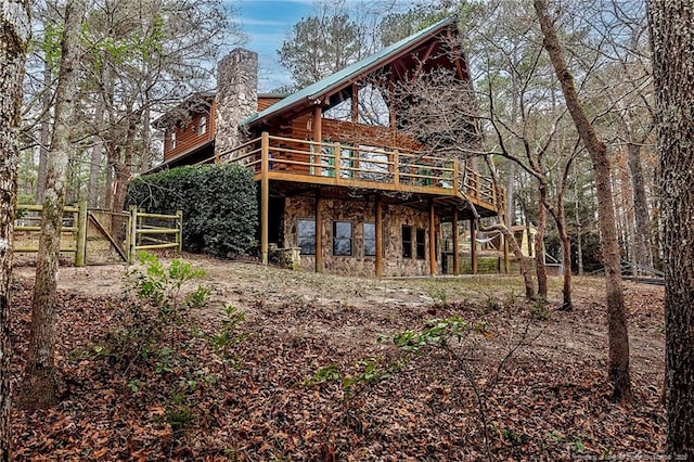 back of property with a wooden deck